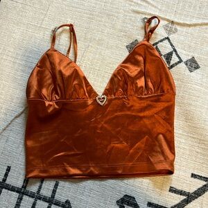 Copper top from Forever 21. Silver heart charms. Size small.